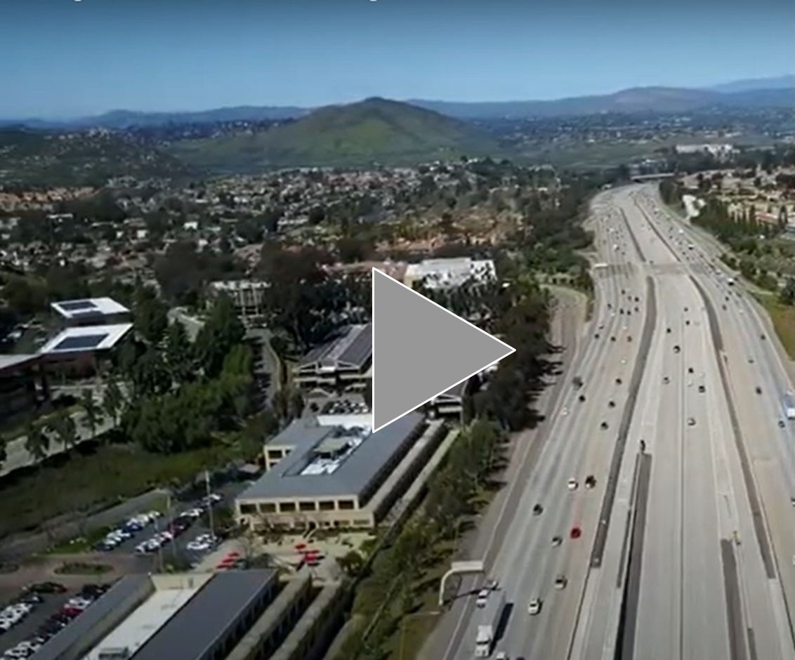 Aerial shot of freeway with free-flowing traffic.