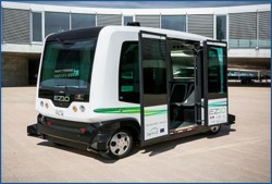 An automated shuttle parked with its doors open.