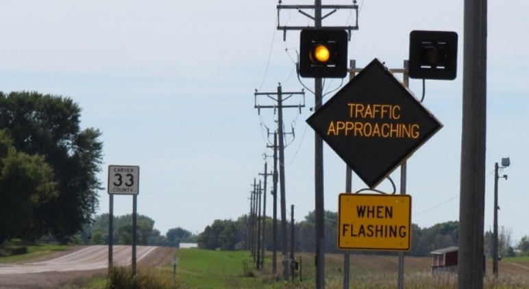 Image of portable warning signs along a rural, low volumn road.