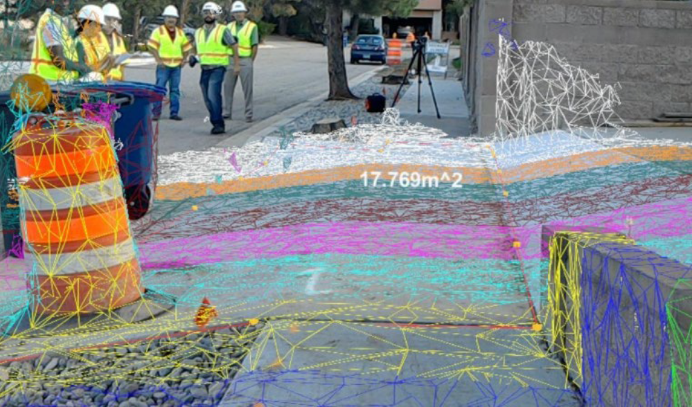 View of a sidewalk, undergoing construction, in augmented reality, showing the gradient of the sidewalk. 