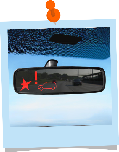 A rear view mirror showing an alert of the potential rear-end crash behind them. The alert consists of a red star, red exclamation mark, and red outline of a car.