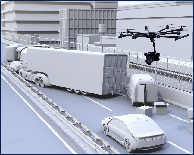 Figure 2 shows a drone (UAV) with a camera attached flying above a roadway where a crash has occurred between a MAC truck and another vehicle.