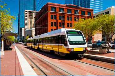A Dallas Area Rapid Transit light rail vehicle making its way through downtown Dallas. 