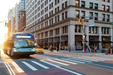 An image of a bus going through an intersection