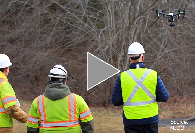  Three New Jersey Depart of Transportation employees demonstrating use of drone.