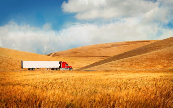 Tractor trailer driving on rural road