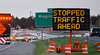 Dynamic message sign showing "stopped traffic ahead" message (Source: FHWA/Texas A&M Transportation Institute)