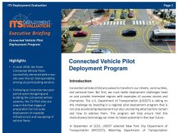 Cover page of the 2019 Connected Vehicle Pilot Deployment Program Executive Briefing, with a graphic of vehicles at a downtown signalized intersection with communication signals surrounding each of the vehicles. 